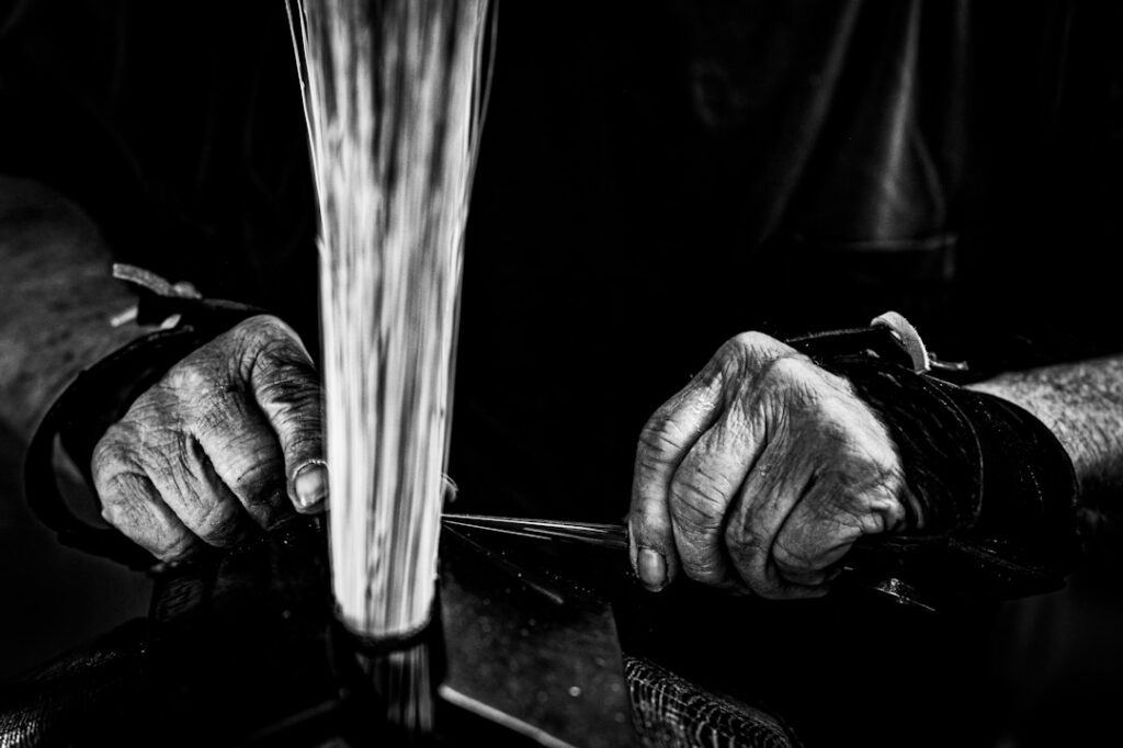 Broom maker at work in his workshop in the Selmer, Tennessee area